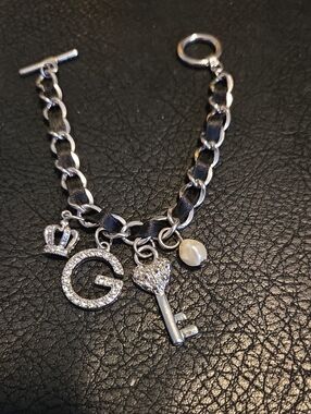 Guess Silver-Tone Charm Bracelet with Black Ribbon, Rhinestone 'G' and Key Charm